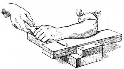 Fig. 66.—Chiselling away Wood up to Gauge Line.