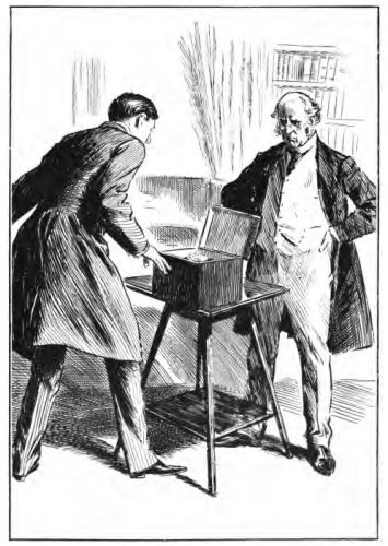 Two men looking into a box