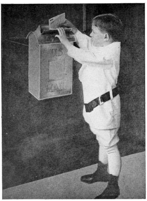 The Home-made Mail-box Strapped to the Face of a Door.