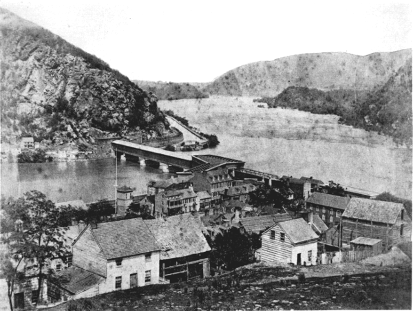 Figure 8.—The Baltimore and Ohio Railroad’s Potomac
River crossing at Harpers Ferry, about 1860. Bollman’s iron “Winchester
span” of 1851 is seen at the right end of Latrobe’s timber structure of
1836, which forms the body of the bridge. (Photo courtesy of Harpers
Ferry National Historical Park.)